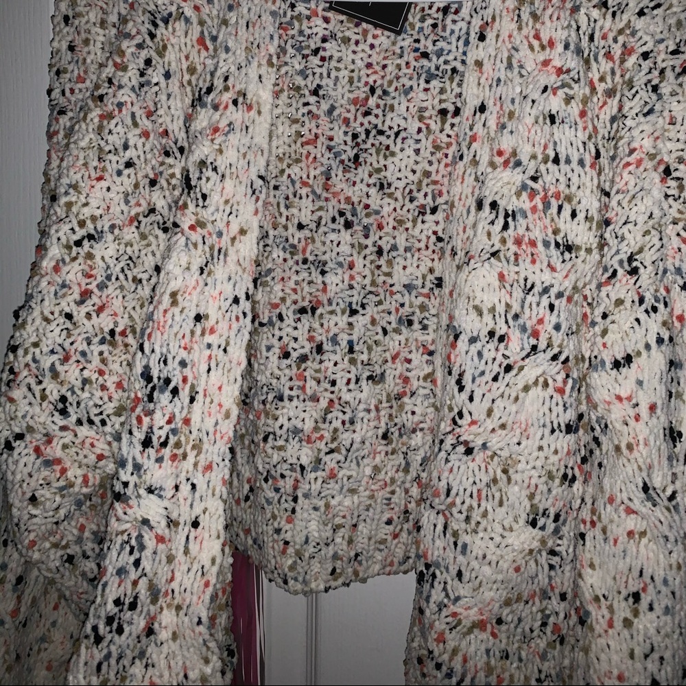 White / dotted knitted cardigan.